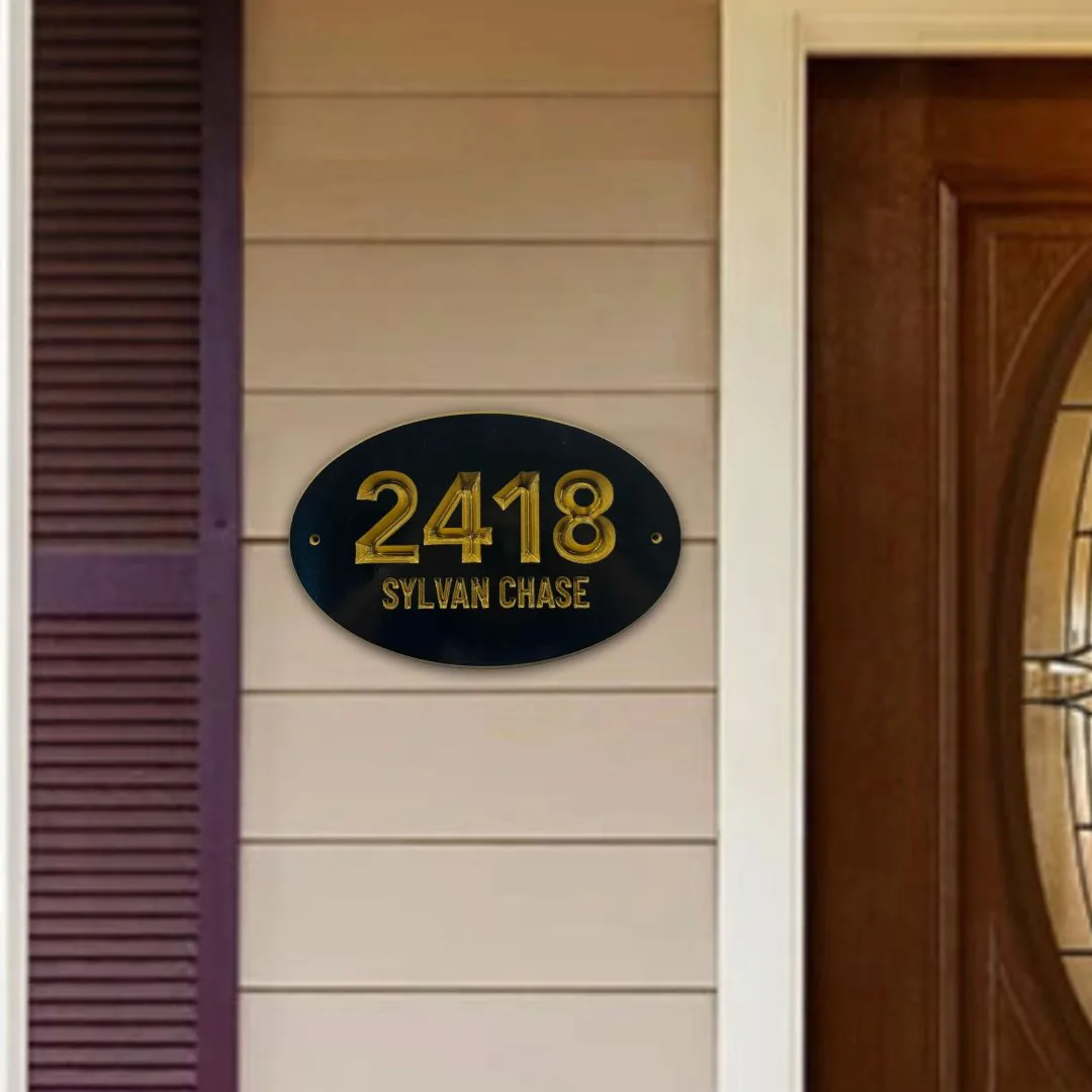 Oval 2418 Sylvan Chase address plaque on siding next to purple shutters