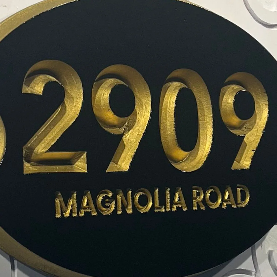 2909 Magnolia Road address plaque, gold V-groove numbers on black