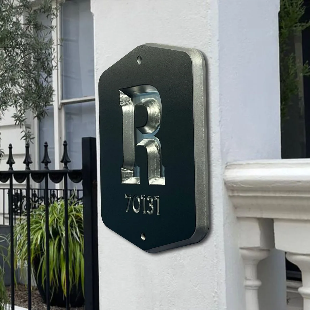 R 70131 home plaque on a white gate pillar