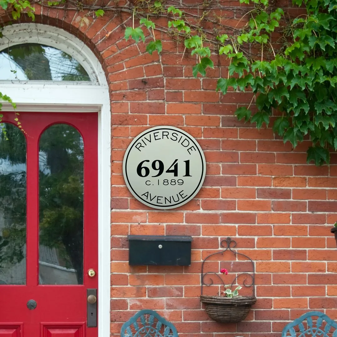 6941 Riverside Avenue historic sign on a brick porch