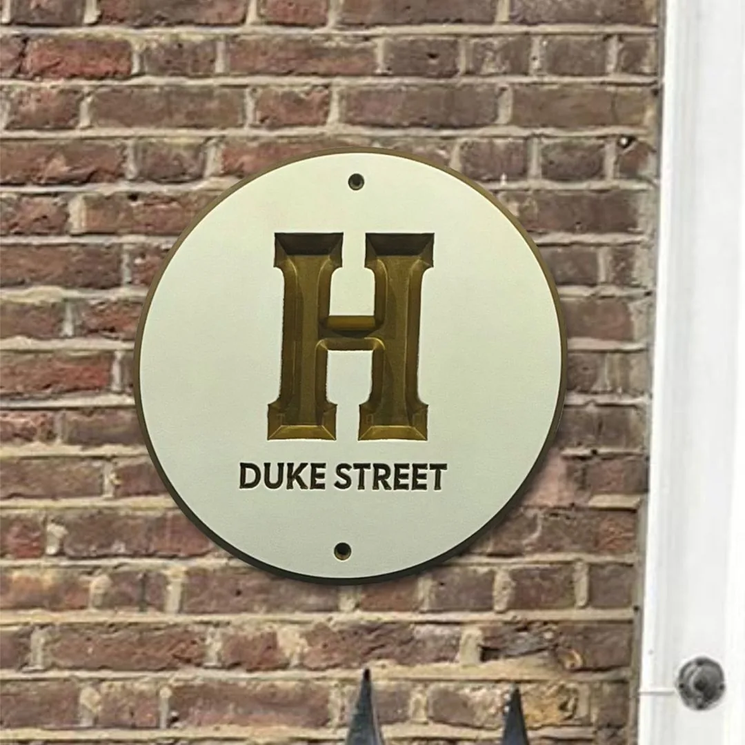 Round H Duke Street house plaque, gold H on ivory