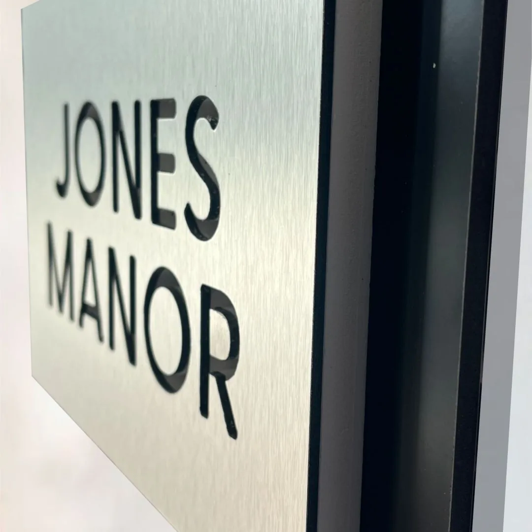 Jones Manor modern home name sign, black letters in brushed aluminum