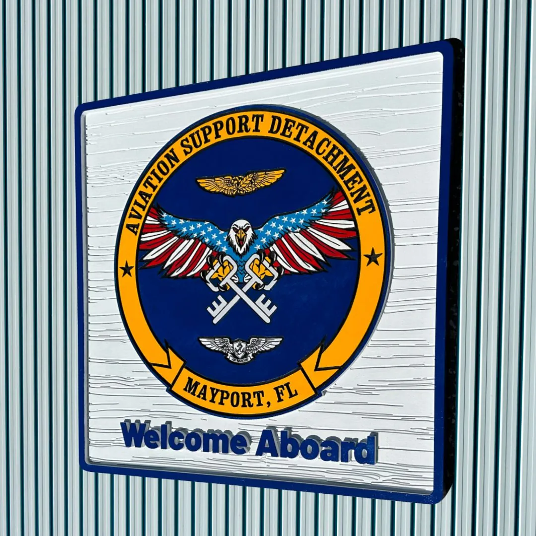 Angled view of the Aviation Support Detachment crest and Welcome Aboard title