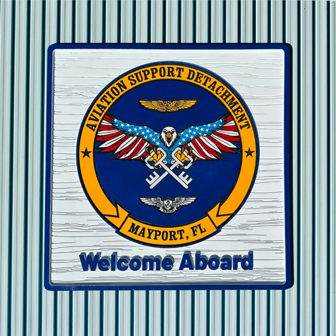 Aviation Support Detachment Mayport crest with a Welcome Aboard title on a ribbed metal wall