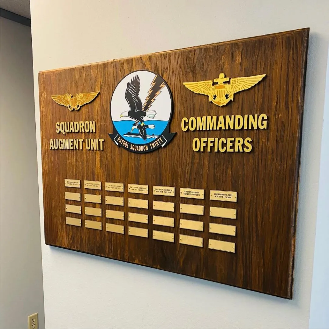 Wood board for Squadron Augment Unit Commanding Officers with eagle emblems and rows of engraved name plates, VP-30