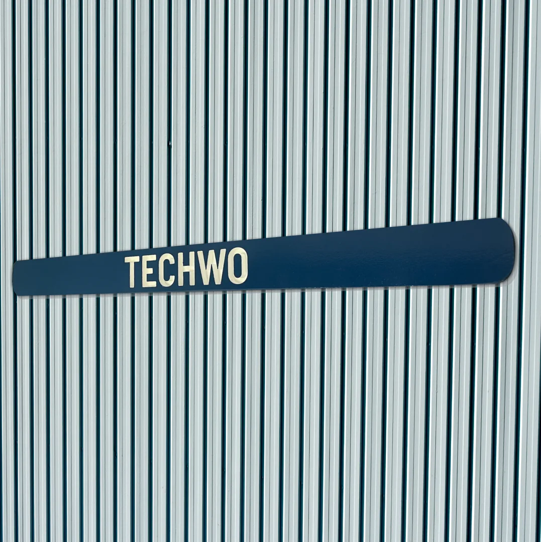 Close view of a blue routed squadron title sign reading TECHWO