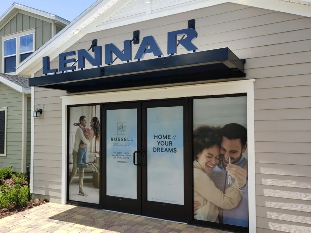 Lifestyle window graphics on the glass doors of the Lennar welcome center, installed by Brand 9 Signs